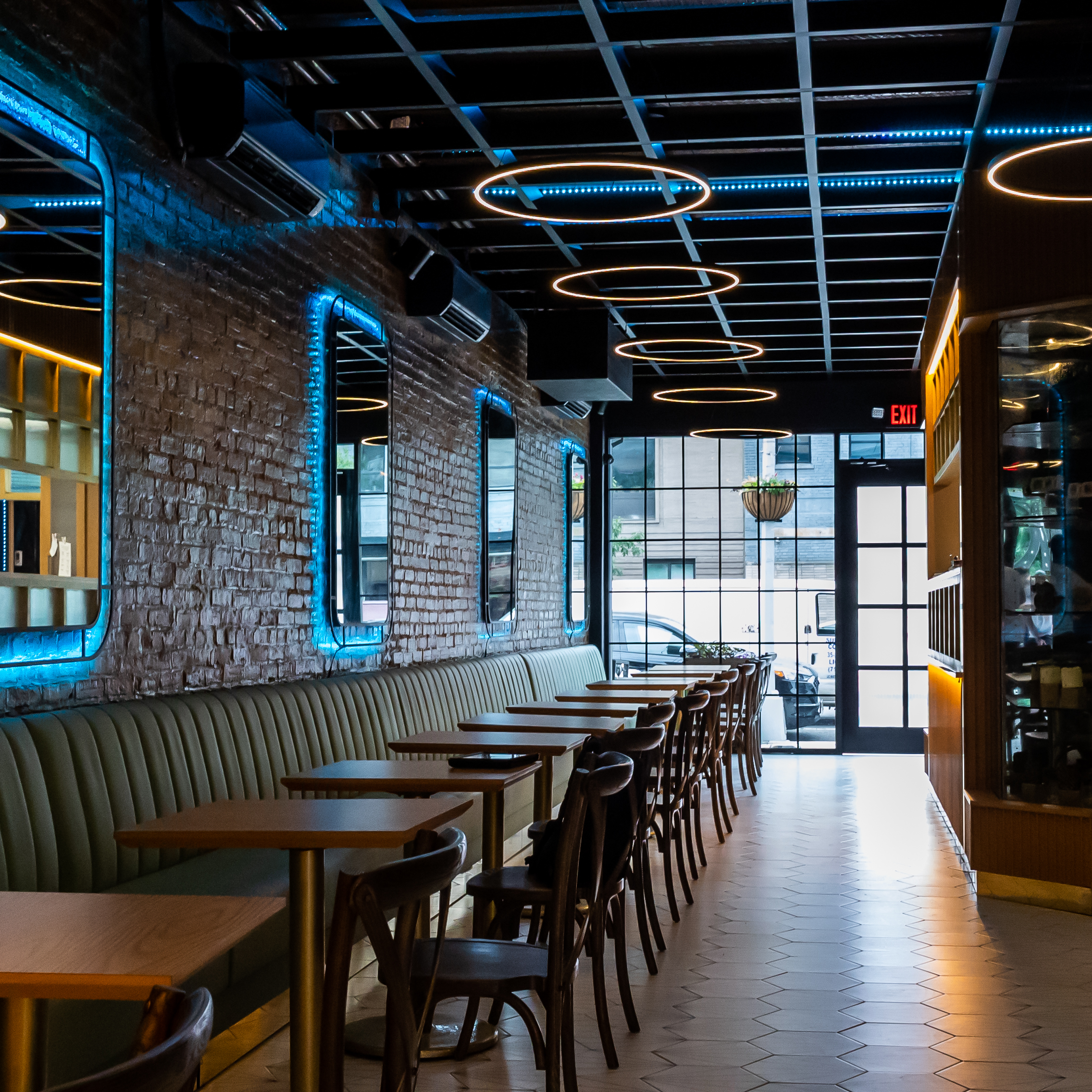 Dining room with brick walls and ring lights